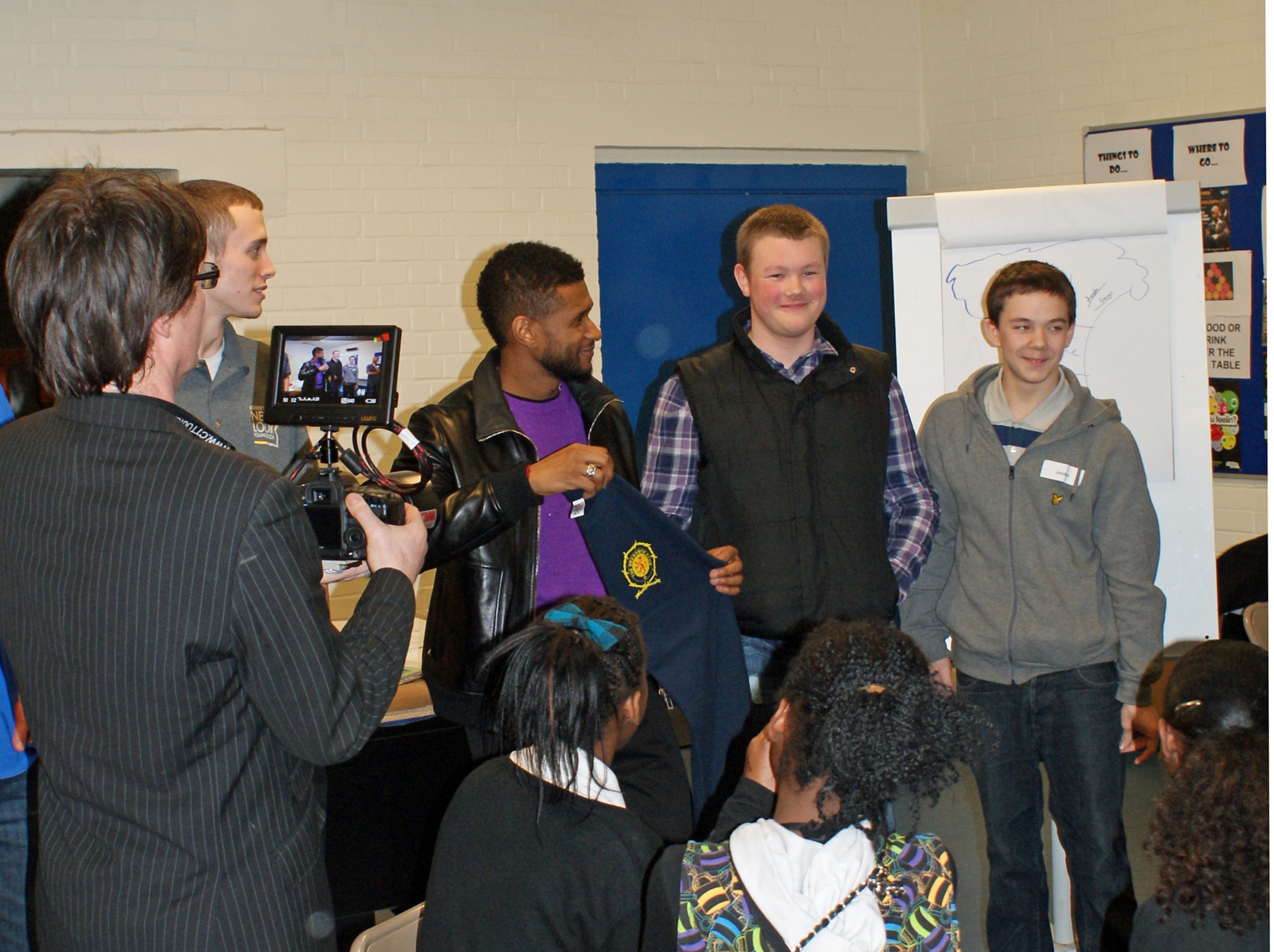 EJordan Ball & Sean Legg of The Brunswick Club present Usher with a Brunswick T shirt (Custom)